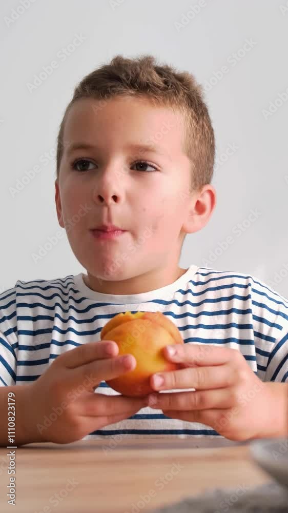 A young boy savors a delicious apple, capturing childhood bliss A young boy savors a delicious apple, capturing childhood bliss