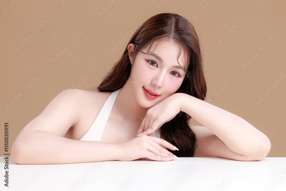 Pretty Asian woman model perfect clear fresh skin smile on isolated beige background. Portrait female beauty blogger make up artist in studio. Skincare, plastic surgery, spa concept. Pretty Asian woman model perfect clear fresh skin smile on isolated beige background. Portrait female beauty blogger make up artist in studio. Skincare, plastic surgery, spa concept.
