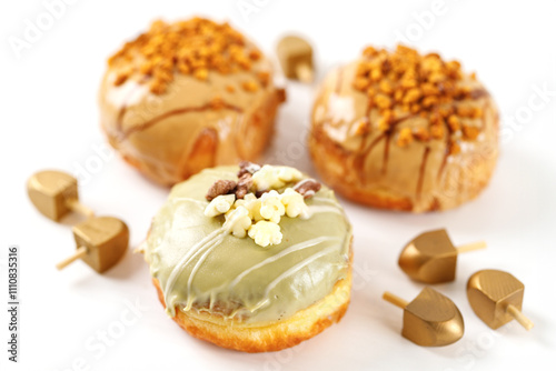 Delicious beautiful donuts sufganiyot traditional Jewish treat for the holiday of Hanukkah photo