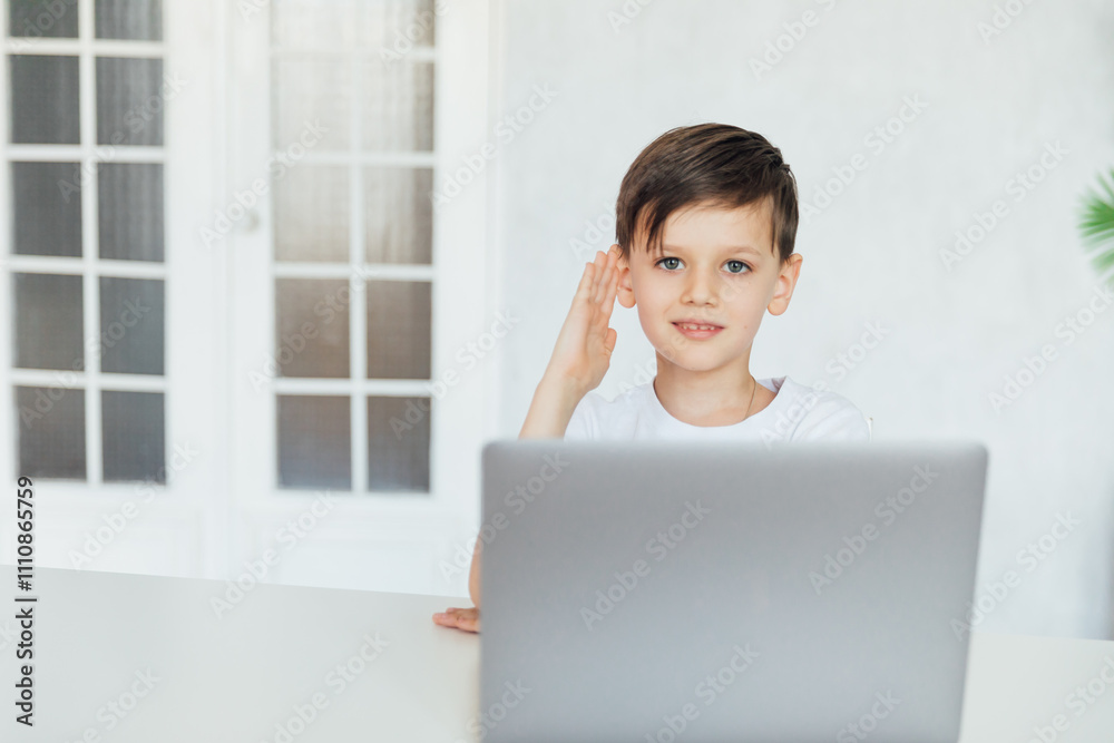 Boy Studying Playing On Laptop Online At Table Boy Studying Playing On Laptop Online At Table