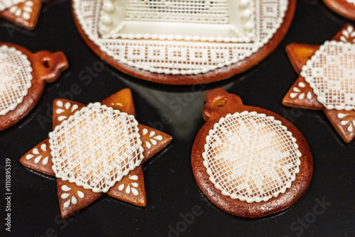 Christmas gingerbread. Artfully made gingerbread made in a festive atmosphere. Colorful gingerbread with handmade patterns. Beautifully made Christmas cookies. photo