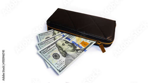  United States Dollars money currency notes inside a black purse isolated on a white background

