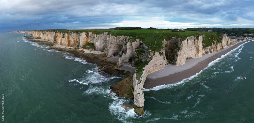 Obraz premium Aerial view of the famous white limestone cliffs near Etretat during sunset, France