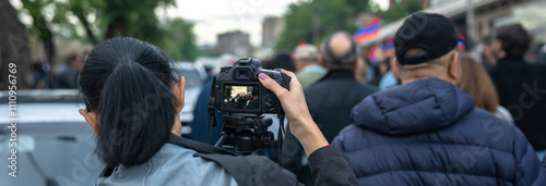 Фотография Loudspeakers on camera during a protest in the city, political unrest