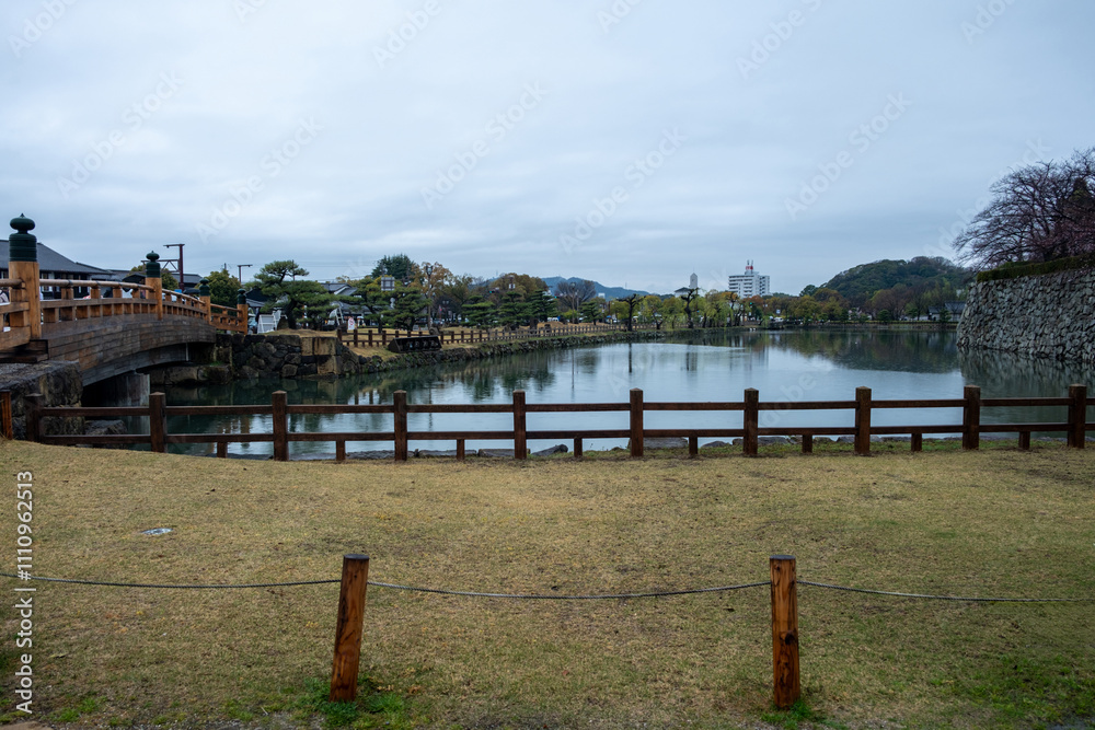 Japan, Sakuramon bridge and white Himeji castle moat, view from the entrance gate Japan, Sakuramon bridge and white Himeji castle moat, view from the entrance gate