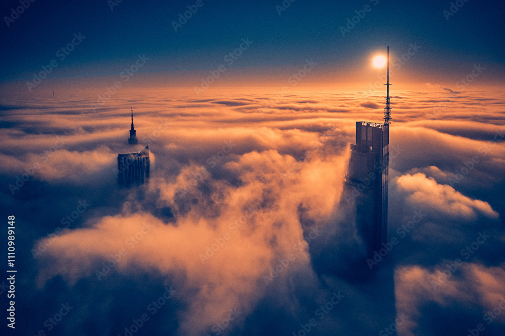 Beautiful panoramic fabulous, mesmerizing, unreal, aerial drone view of skyscrapers sticking out of low fog at sunrise, Warsaw, Poland, EU. VARSO - the tallest skyscraper in EU.