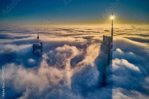 Obraz na płótnie Beautiful panoramic fabulous, mesmerizing, unreal, aerial drone view of skyscrapers sticking out of low fog at sunrise, Warsaw, Poland, EU. VARSO - the tallest skyscraper in EU. w salonie