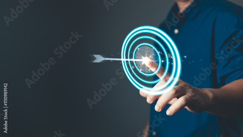 glow arrow hitting the center of a target symbolizes focus, purpose, mission, and the determination to achieve goal, highlighting precision, strategy, and success in personal or professional pursuits. photo