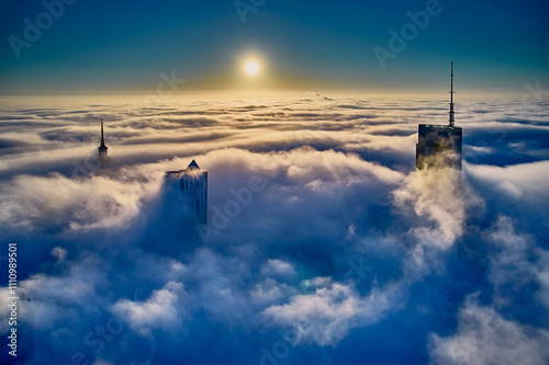 Obraz na płótnie Beautiful panoramic fabulous, mesmerizing, unreal, aerial drone view of skyscrapers sticking out of low fog at sunrise, Warsaw, Poland, EU. VARSO - the tallest skyscraper in EU. w salonie