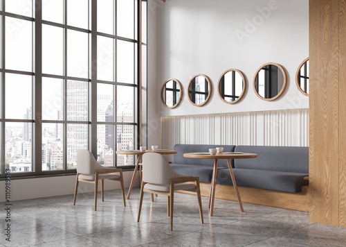 Modern cafe interior with round wooden tables, upholstered chairs, and large windows with city view in background. 3D Rendering