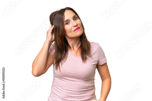 Middle-aged caucasian woman over isolated background having doubts