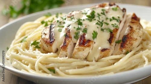 Photo of, A mouthwatering plate of chicken alfredo pasta with creamy garlic sauce, grilled chicken breast