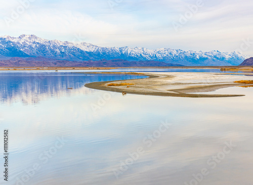 Early Morning Reflections of The Sierra Nevada Mountains Flooded Owens Lake, Lone Pine, California, USA photo