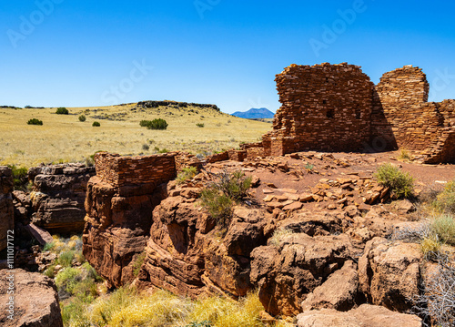 Ruins of Box Canyon Pueblo With The San Francisco Peaks in The Distance, Wupatki National Monument, Arizona, USA photo