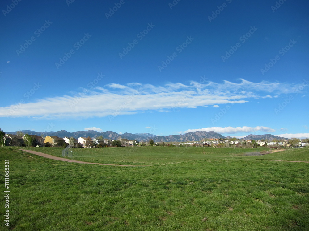 Fototapeta premium Atmospheric gravity waves clouds, Karman vortex breaking waves over Flatirons Boulder, Colorado
