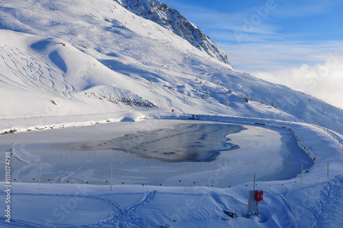 Swiss alps: Frozen lake for snow farming at Rothorn in Lenzerheide photo