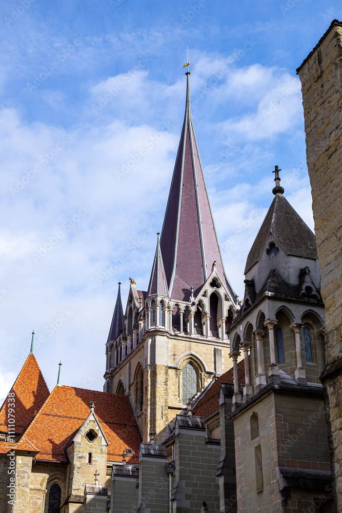 Lausanne's iconic cathedral has distinctive red-tiled roof and showcases Gothic architectural styles Lausanne's iconic cathedral has distinctive red-tiled roof and showcases Gothic architectural styles