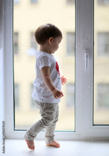 Toddler  looking out window