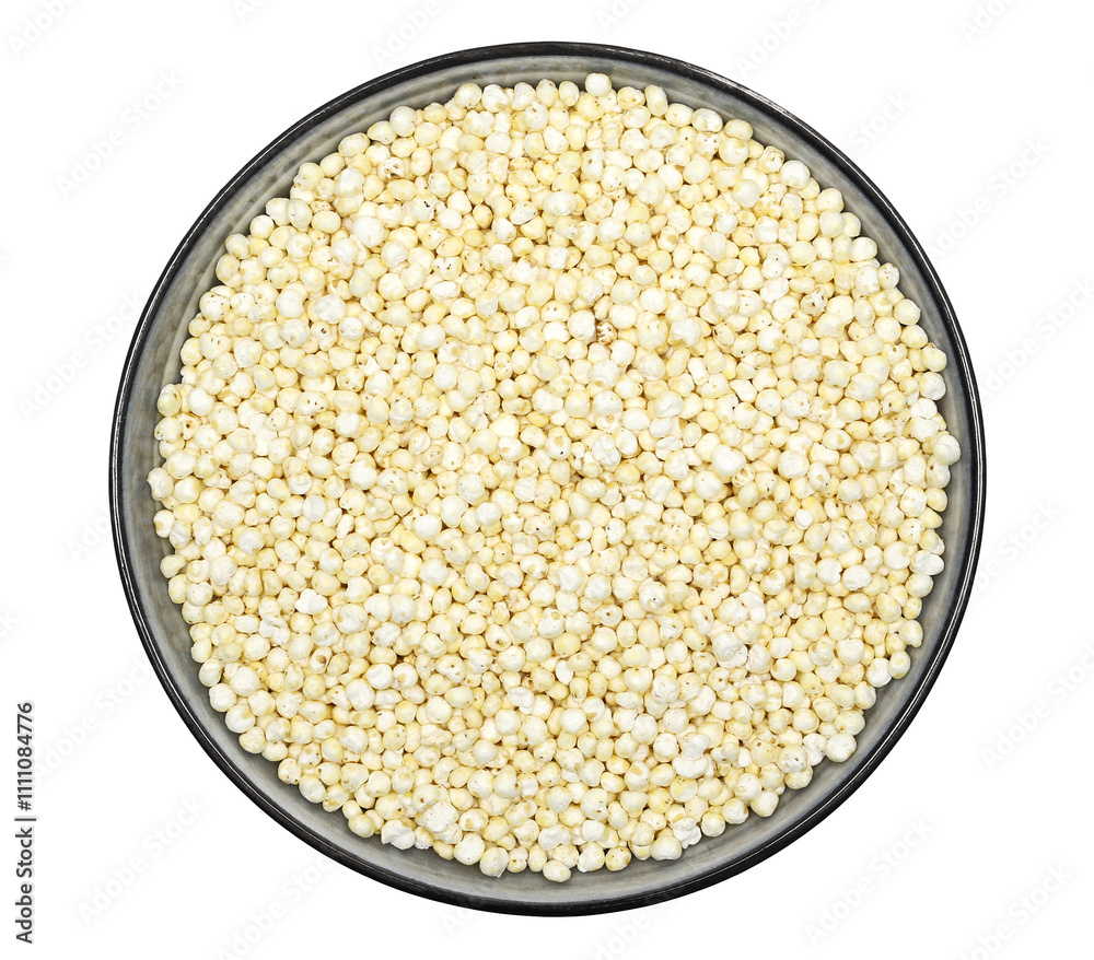 Puffed millet in porcelain bowl isolated on white, top view Puffed millet in porcelain bowl isolated on white, top view