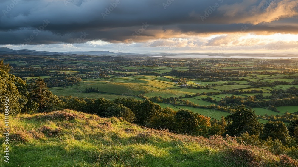 A picturesque landscape at sunset, showcasing rolling hills and lush green fields under dramatic clouds. A picturesque landscape at sunset, showcasing rolling hills and lush green fields under dramatic clouds.