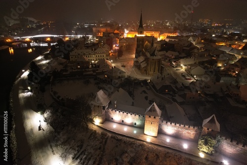 Aerial night panorama of Nymburk town illuminated with Christmas lights and festive decorations, creating a magical holiday atmosphere in this historic town photo