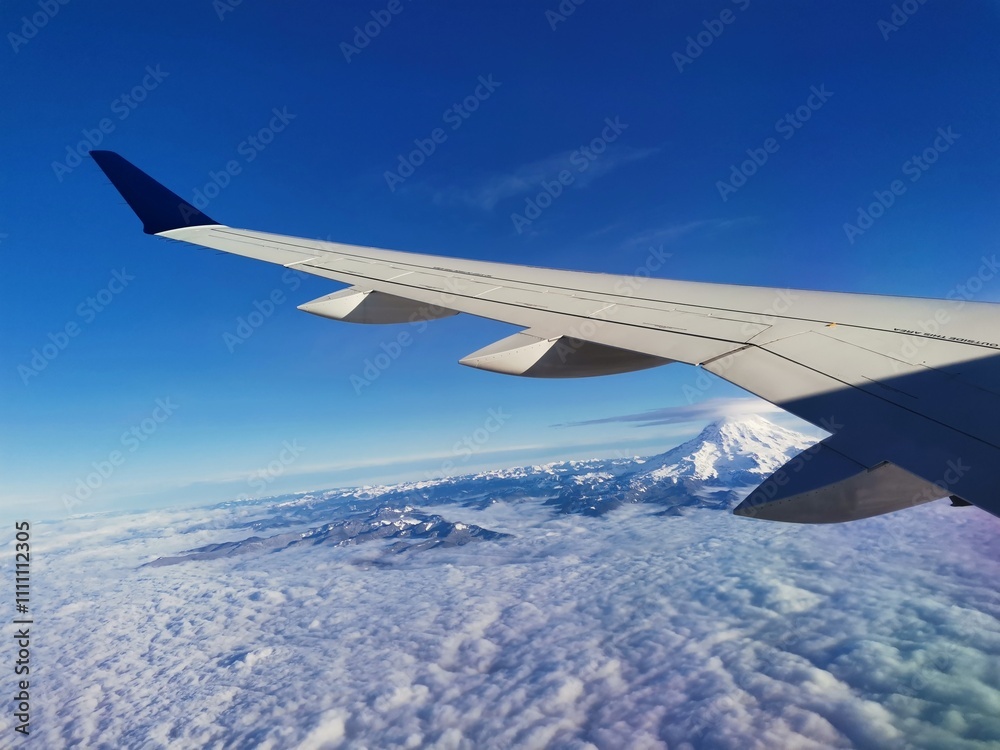 Airplane window view mountain and snow Airplane window view mountain and snow