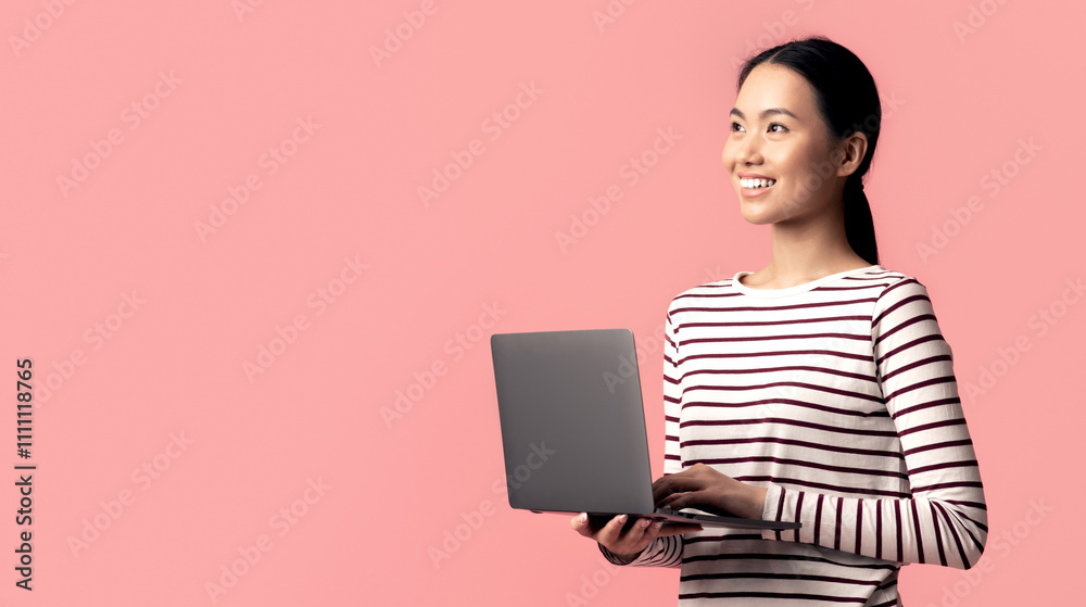 Online Education Programs. Portrait Of Young Asian Female With Laptop Computer Standing Over Pink Background And Looking Aside At Copy Space, Smiling Korean Female Enjoying Distance Learning Online Education Programs. Portrait Of Young Asian Female With Laptop Computer Standing Over Pink Background And Looking Aside At Copy Space, Smiling Korean Female Enjoying Distance Learning
