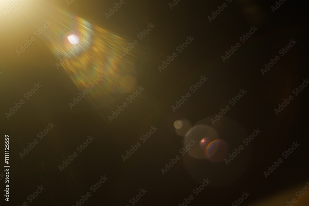 Easy to add lens flare effects for overlay designs or screen blending mode to make high-quality images. Abstract sun burst, digital flare, iridescent glare over black background. Easy to add lens flare effects for overlay designs or screen blending mode to make high-quality images. Abstract sun burst, digital flare, iridescent glare over black background.