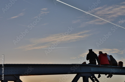 Silhouetten auf der blauen Brücke in Freiburg photo