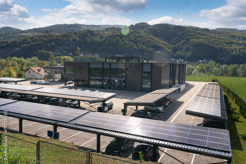 Fototapeta Naklejka Na Ścianę i Meble -  Parking space with solar panels on a roof