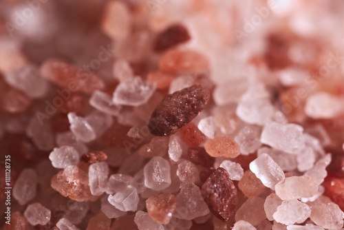 Pink Himalayan salt. Pink salt rocks. Pink Himalayan rare salt crystal close-up background. Spices and food and seasoning concept. Coarse Pink Himalayan Salt