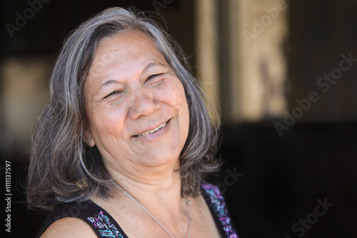 closeup portrait of  cheerful guarani senior latino woman   photo