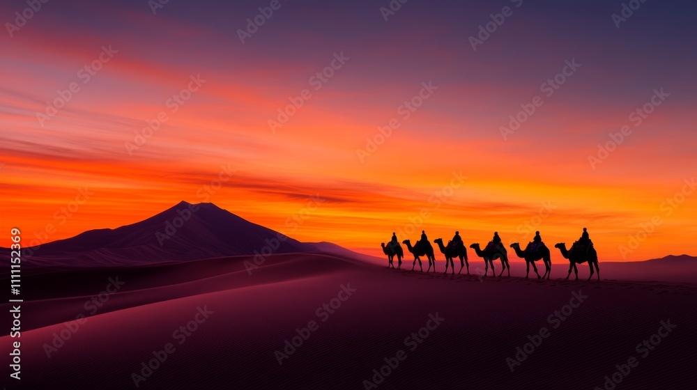 Fototapeta premium Silhouetted camel caravan traversing a desert landscape at sunset, fiery orange sky above.