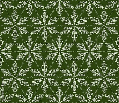 Green holiday seamless pattern of winter motif. Northern ethnic ornament. White ornate snowflakes on dark green background. Romantic christmas design. Monochrome folklore ornament. Hexagonal elements