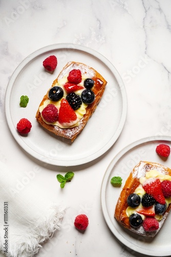 Fruit berry tarts with fresh berries on top, selective focus