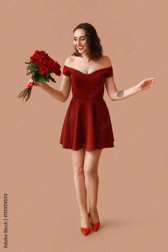 Beautiful young woman with bouquet of red roses on brown background Beautiful young woman with bouquet of red roses on brown background