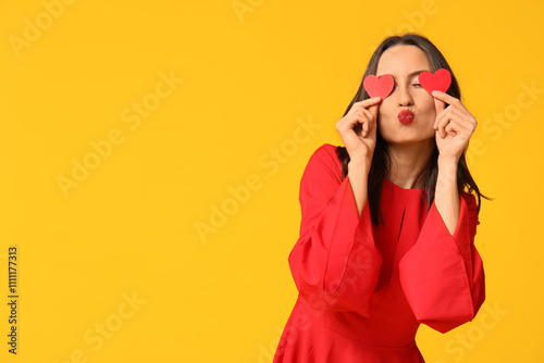 Playful woman in red dress ...