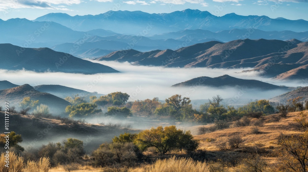 Obraz premium Misty Mountain Landscape with Autumnal Trees