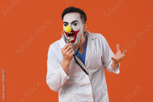 Young man as clown doctor s...