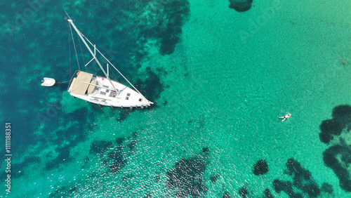 Aerial drone photo of paradise secluded beach with crystal clear emerald sea in tropical exotic destination island photo