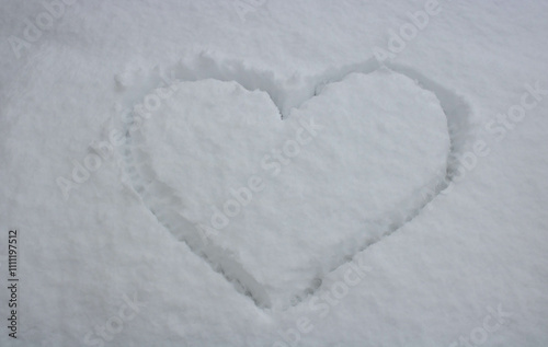 A big heart painted on fluffy snow. The concept of love, Valentine's Day, March 8th