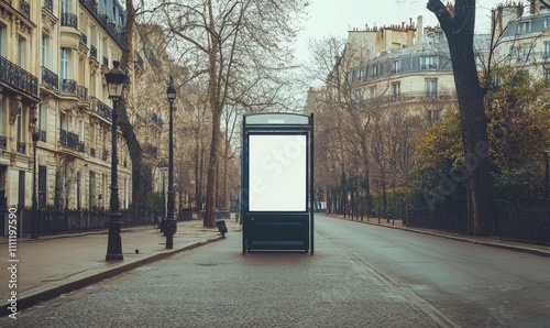 A mockup of a bus stop billboard in an empty street in Paris - a Parisian style advertisement near a beautiful park photo