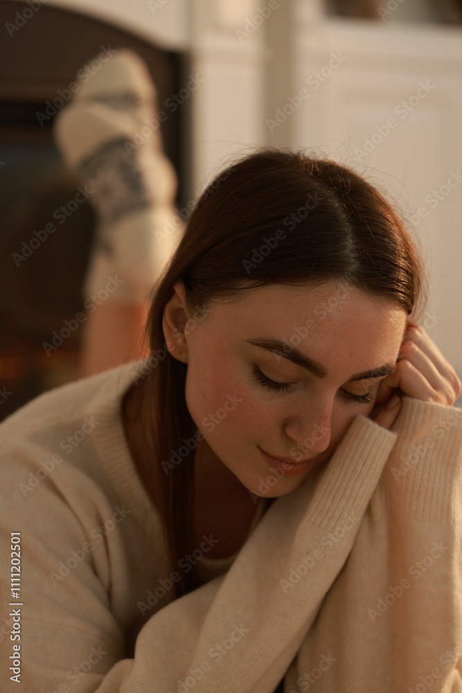 Fototapeta premium Woman in warm sweater resting at home