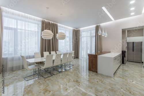 Magnificent bright dining room with beige floor tiles. White furniture and original pendant lights.