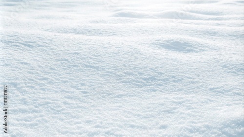 Close-up of fresh, fluffy snow on the ground, showcasing a beautiful winter texture with a subtle bluish tint