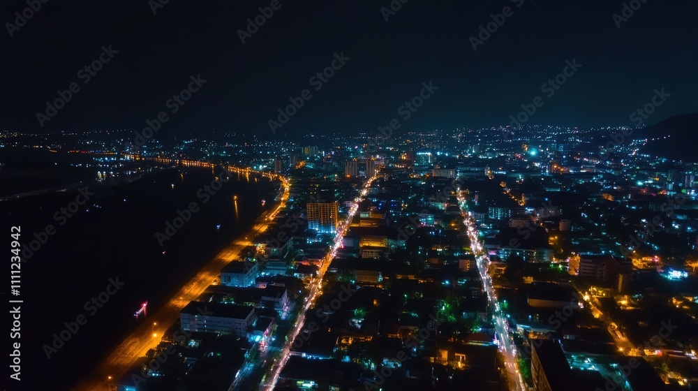 Fototapeta premium Stunning Aerial Night View of a Winter Cityscape in Thailand Under the Starry Sky