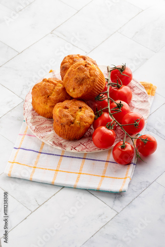 savory snack cakes muffins with corn and tomatoes - selective focus