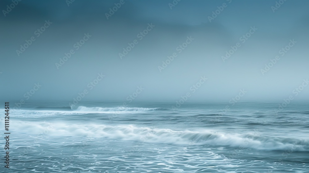 Serene view of the ocean with gentle waves under a misty, overcast sky, creating a peaceful and tranquil seascape atmosphere. Serene view of the ocean with gentle waves under a misty, overcast sky, creating a peaceful and tranquil seascape atmosphere.