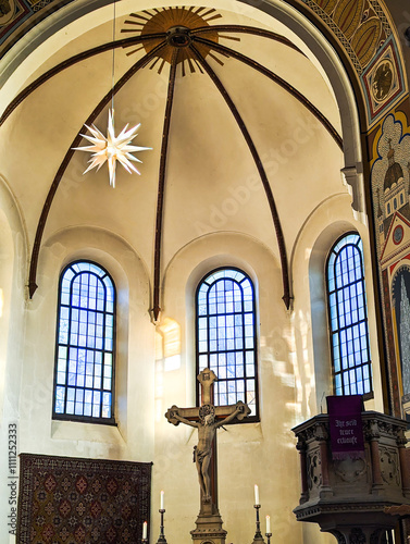 Bright multi-pointed star hangs under the dome of the church  a symbol of Christmas.