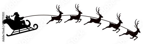 Santa Claus rides in a sleigh in harness on the reindeer
